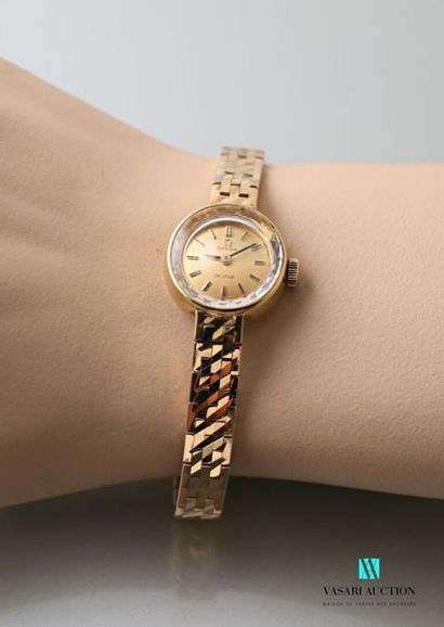 null Ladies' wristwatch in 750-thousandths yellow gold, dial with champagne background...