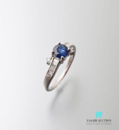 null 750 thousandths white gold ring set with a round sapphire calibrating 0.85 carats...
