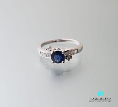 null 750 thousandths white gold ring set with a round sapphire calibrating 0.85 carats...