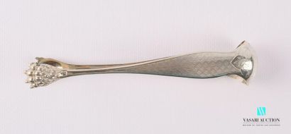 null Silver sugar tongs, the arms decorated with guilloché reserves surmounted by...