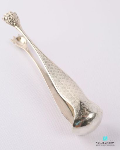 null Silver sugar tongs, the arms decorated with guilloché reserves surmounted by...