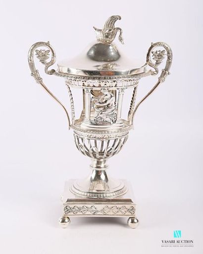 null Silver jam maker (1819-1838) resting on a square base hemmed with laurel branches...