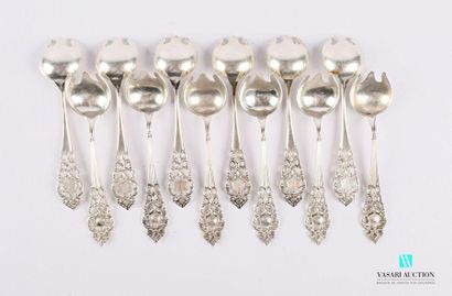 null Set of twelve silver dessert forks with openwork handle decorated with foliage...