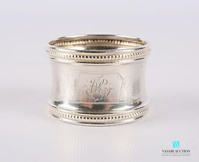 null Silver napkin ring with a concave belly presenting a ciphered cartouche inscribed...