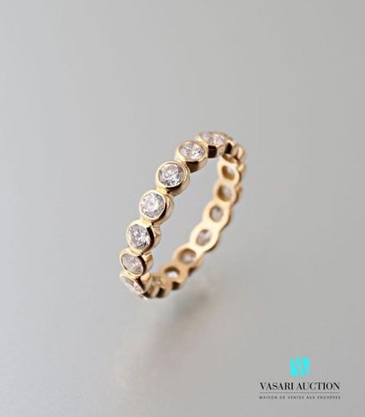 null Wedding ring in 750 thousandths yellow gold decorated in closed settings with...