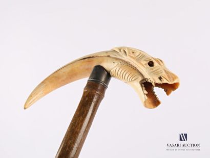 null Cane with warthog tooth pommel carved with a tiger's head, bamboo
shaft (one...