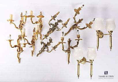 null Set including a pair of gilded metal wall lights with two light arms, the fluted...