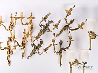 null Set including a pair of gilded metal wall lights with two light arms, the fluted...