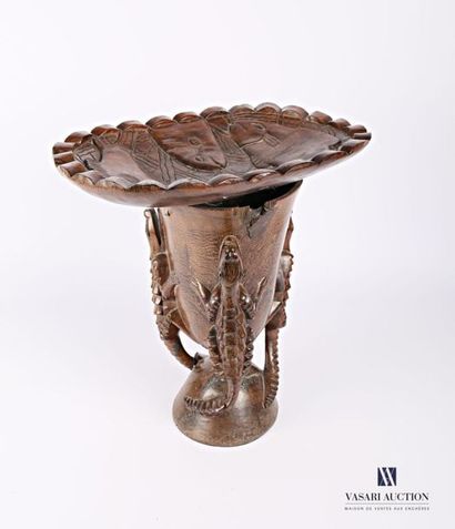 null Carved wooden stool, the curved seat is decorated with fish, it rests on a base...