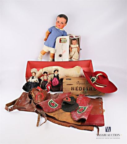 null Set of dolls including a plastic doll "Roso" in its red plastic case and its...