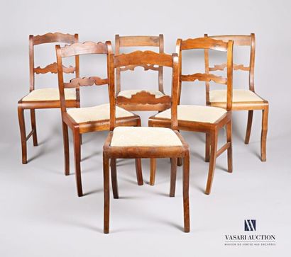 null A suite of six chairs of similar design in natural wood, the backs have a central...