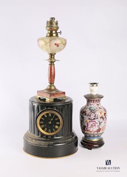 null Black marble bollard clock featuring a column base decorated with fluting, the...