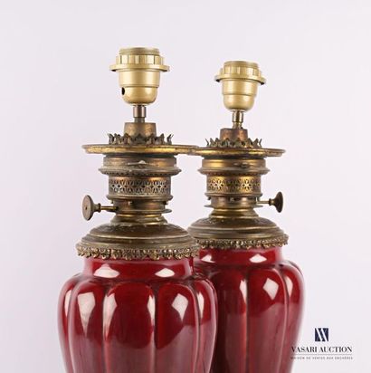 null Pair of ox blood earthenware lamp bases decorated with gadroons, the bronze...