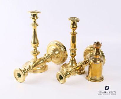 null Two pairs of brass torches resting on a round to soft base decorated with fillets,...