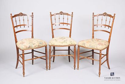null Suite of three chairs, the openwork backrest decorated with bars is surmounted...