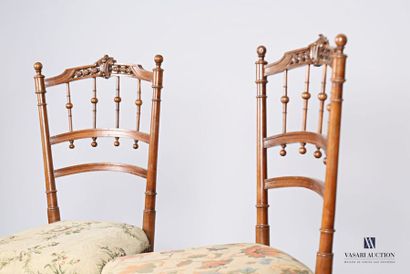 null Suite of three chairs, the openwork backrest decorated with bars is surmounted...