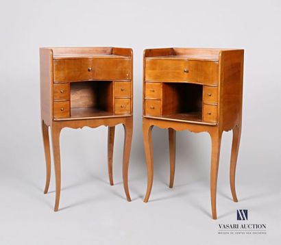 null Pair of cherry wood bedside tables with a concave front presenting a niche flanked...