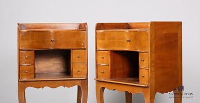 null Pair of cherry wood bedside tables with a concave front presenting a niche flanked...