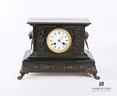 null A black granite clock with a rectangular shape, the dial is round with Roman...