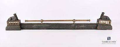 null Fire bar in patinated metal with a goat decoration resting on an openwork balustrade...