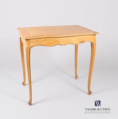 null Moulded natural wood writing table, the top with a wavy edge rests on four curved...