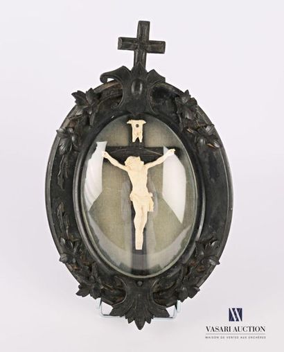null Resin Crucifix in a blackened wooden frame hemmed with leafy
branches (missing...