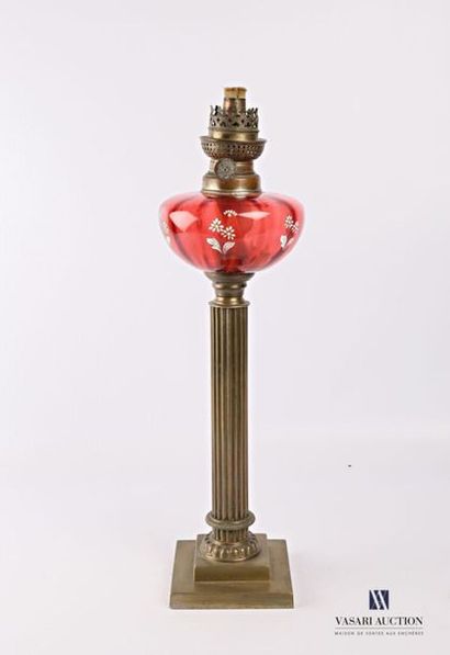 null Bronze oil lamp resting on a square stepped base, the columnar shaft decorated...