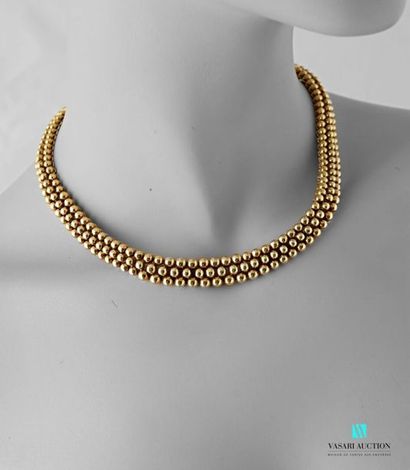 null Butcher's necklace circa 1980, 750 thousandths yellow gold set decorated with...