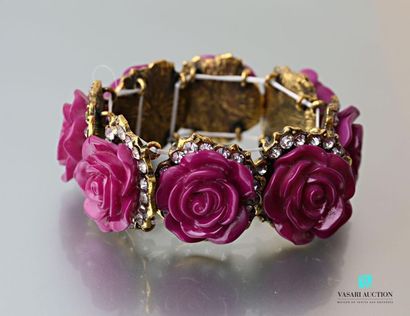 null Bracelet on elastic cord decorated with purple resin flower motifs hemmed with...
