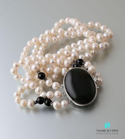 null Three-row necklace of freshwater cultured pearls, the metal clasp adorned with...