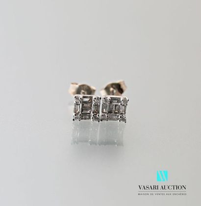 null Pair of 750 thousandths white gold earrings set with baguette-cut diamonds,...