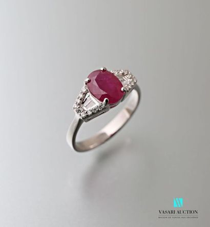 null 750 thousandths white gold ring set in its centre with a ruby of approximately...