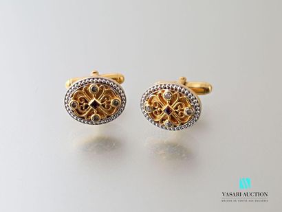 null Vermeil cufflinks with filigree decoration adorned with tourmaline and diamonds.
Gross...