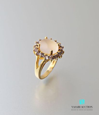 null Vermilion ring centered of a cabochon cut moonstone hemmed with round cut amethyst.
Gross...