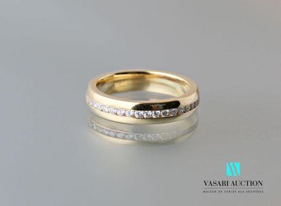 null A way to love" wedding band in 750 thousandths yellow gold set with a central...