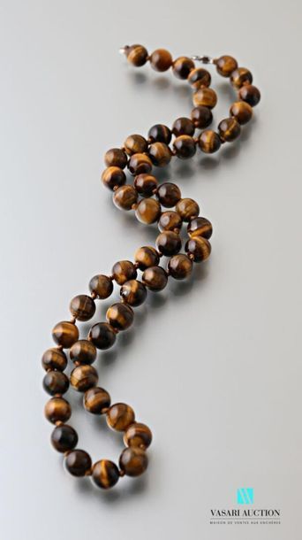 null Necklace decorated with tiger eye beads, the clasp snap hook in metal
Length...