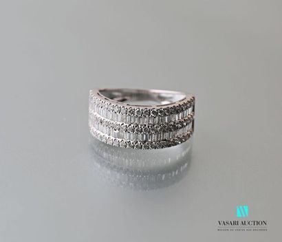 null 750 thousandths white gold ring set with three lines of modern cut diamonds...