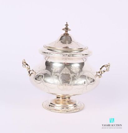null A round silver sugar bowl resting on a pedestal base hemmed with a frieze of...