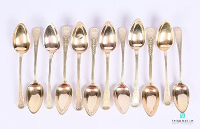 null Suite of twelve silver gilt teaspoons (1809-1819), the handle with a row and...