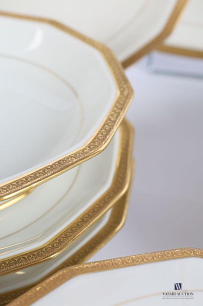 null LIMOGES
White porcelain dinner services with golden band decorated with water...