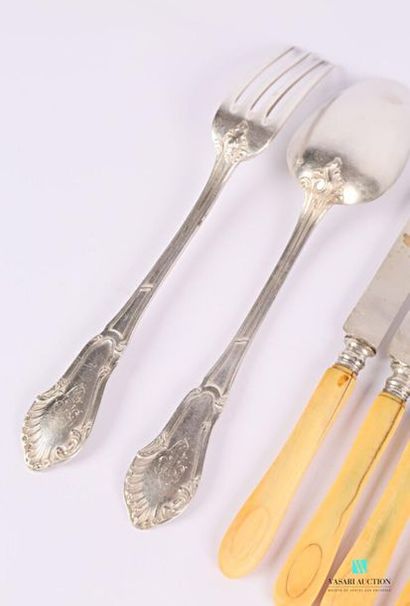 null Silver tableware, the handle decorated with net with a decoration of leafy branches...