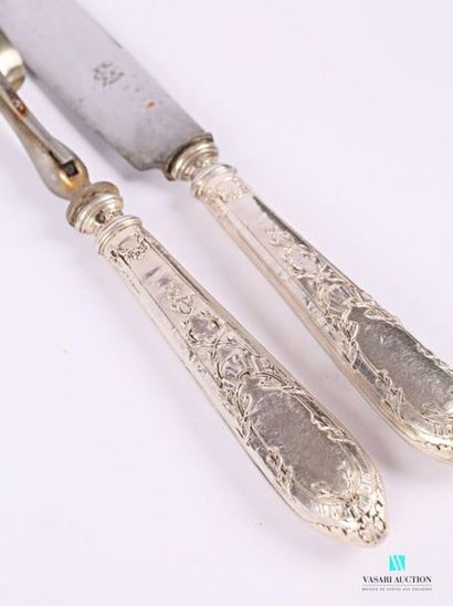 null Cutlery service cover, the silver handle filled with filleted decoration ending...