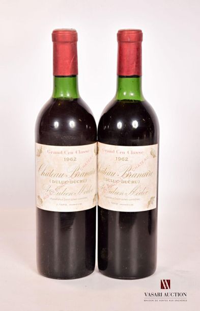 null 2 bouteilles	Château BRANAIRE DUCRU	St Julien GCC	1962
	Et. tachées. N : 1 limite...