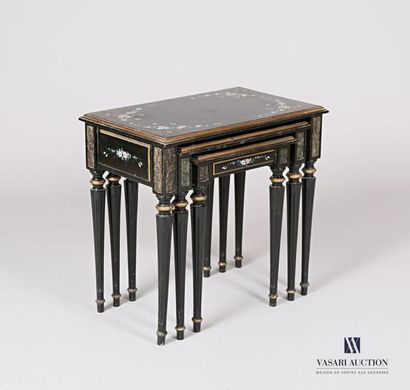null Suite of three nesting tables in moulded and lacquered wood with polychrome...