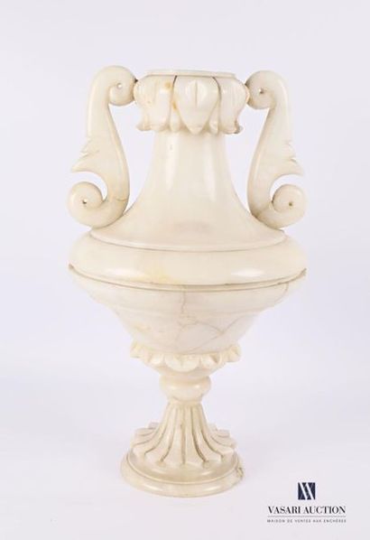 null Alabaster lamp in two parts resting on a base with a grooved doucine, it supports...