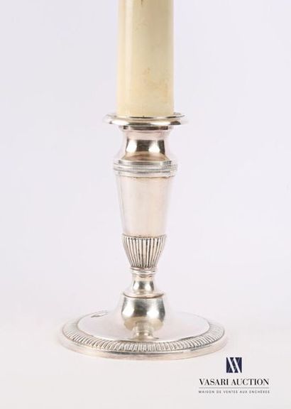 null Lamp base in silvery metal, the baluster shaft surmounted by a false candle...