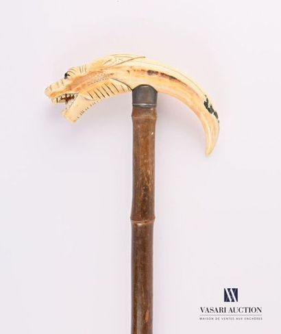 null Cane the pommel in warthog tooth carved with a tiger head, the shaft in bamboo
(one...