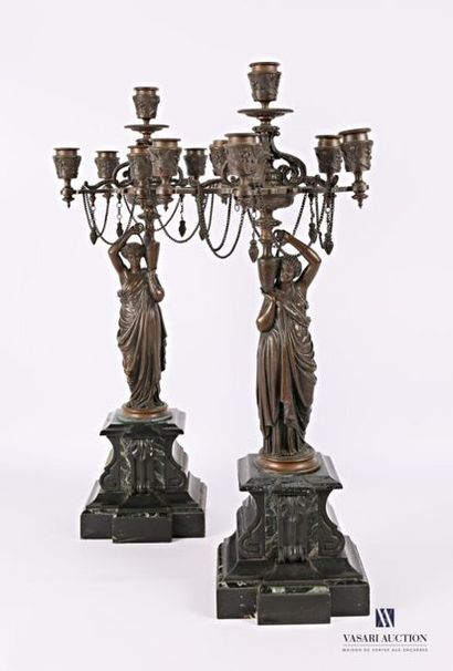 null Pair of bronze candelabra with a brown patina, the shaft representing vestals...