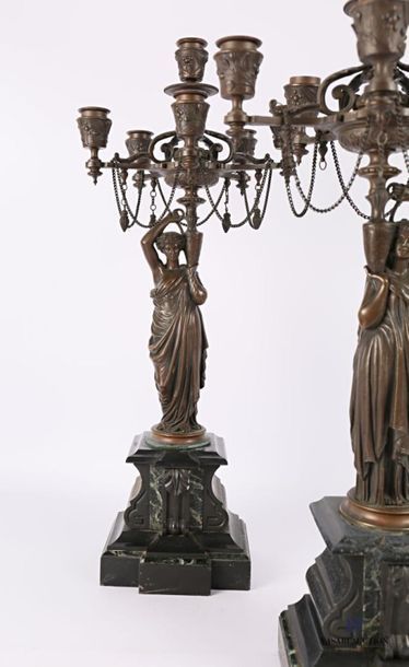 null Pair of bronze candelabra with a brown patina, the shaft representing vestals...