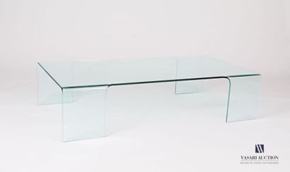 null Glass coffee table, the rectangular shaped top rests on four legs with slight...